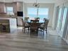 Dining area and kitchen with Gulf views and open floor plan.
