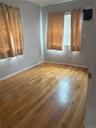 Unfurnished room with hardwood / wood-style floors and baseboards