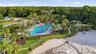 Cory Lake Isles Beach club with resort style lagoon pool, water slide and zero entry (beach-style) pool  access and playground