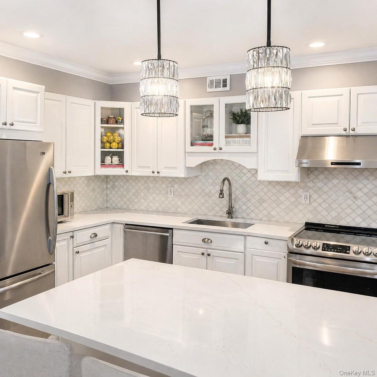 Kitchen featuring Granite countertops Granite Island and Stainless-Steel appliances
