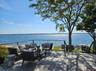 Deck with a water view and an outdoor living space