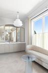 Bathroom with healthy amount of natural light and vanity