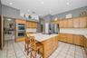 Kitchen showing concealed walk-in pantry