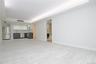 Unfurnished living room featuring a tray ceiling and recessed lighting
