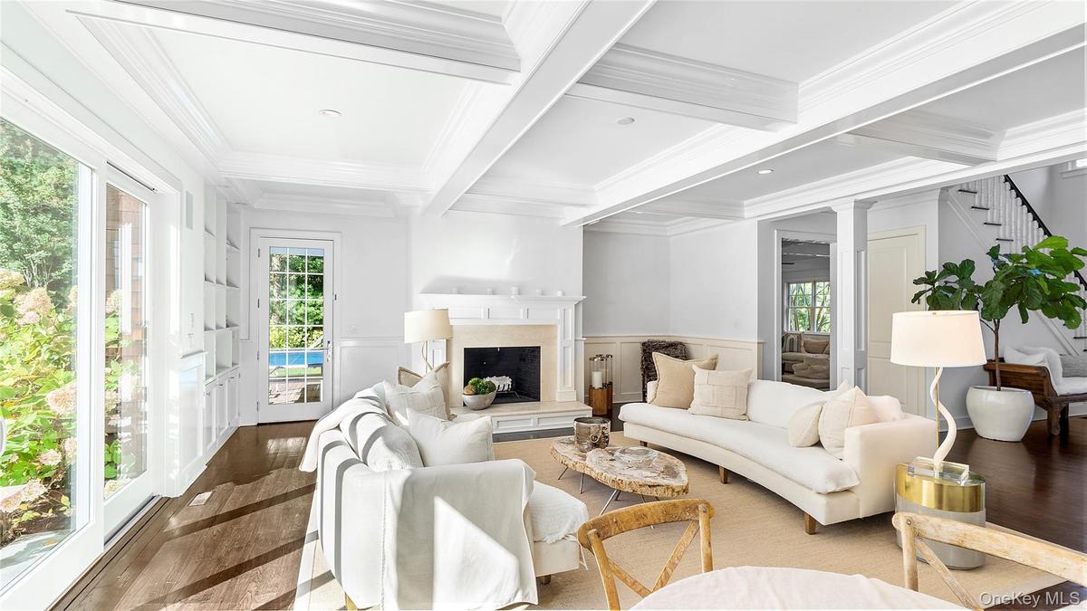 Main living area open to the covered porch and grounds
