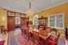 Dining room with a chandelier, ornamental molding, healthy amount of natural light, recessed lighting, and light tile patterned floors