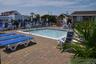 Community pool with a patio area