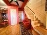 Main entrance on the 9th floor, coat closet and more storage under the stairs