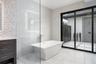 There is a large freestanding soaking tub.