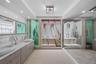 The recently remodeled spa-inspired bathroom includes dual vanities, an oversized walk-in shower, and a beautiful clawfoot soaking tub designed for re