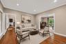 Virtually staged formal living room.
