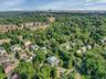 Aerial view of property's location with a forest