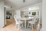 Dining space featuring light wood-style floors and stairway