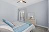 Hurricane rated French doors open to a Juliette balcony overlooking private courtyard.