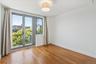 Spare room featuring baseboards and light wood finished floors