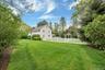 View of yard with view of wooded area