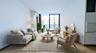 Living area featuring a wall of windows, electric panel, light wood-type flooring, and a wall unit AC