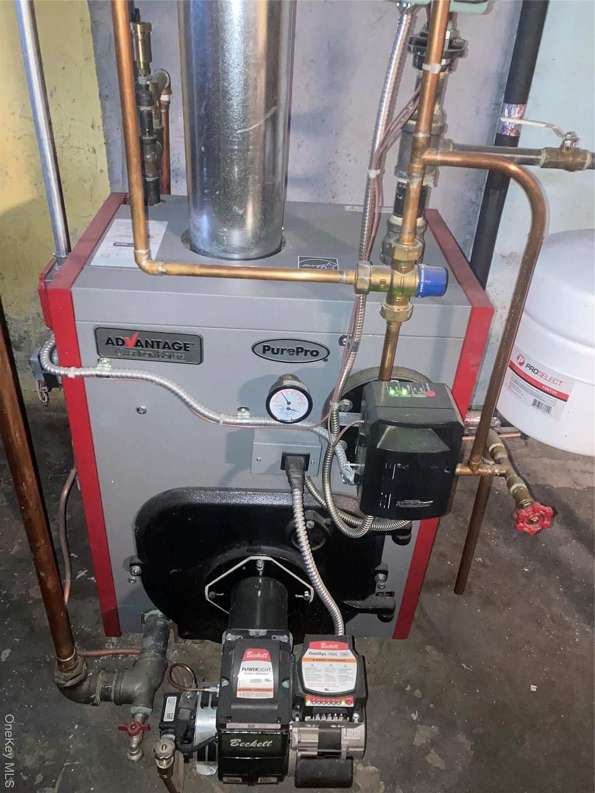 Utility room featuring a heating unit