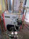 Utility room featuring a heating unit