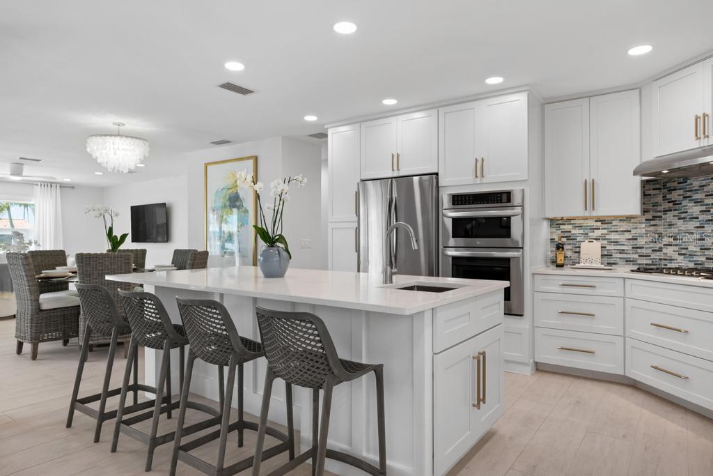 Kitchen with Breakfast bar island and stainless appliances