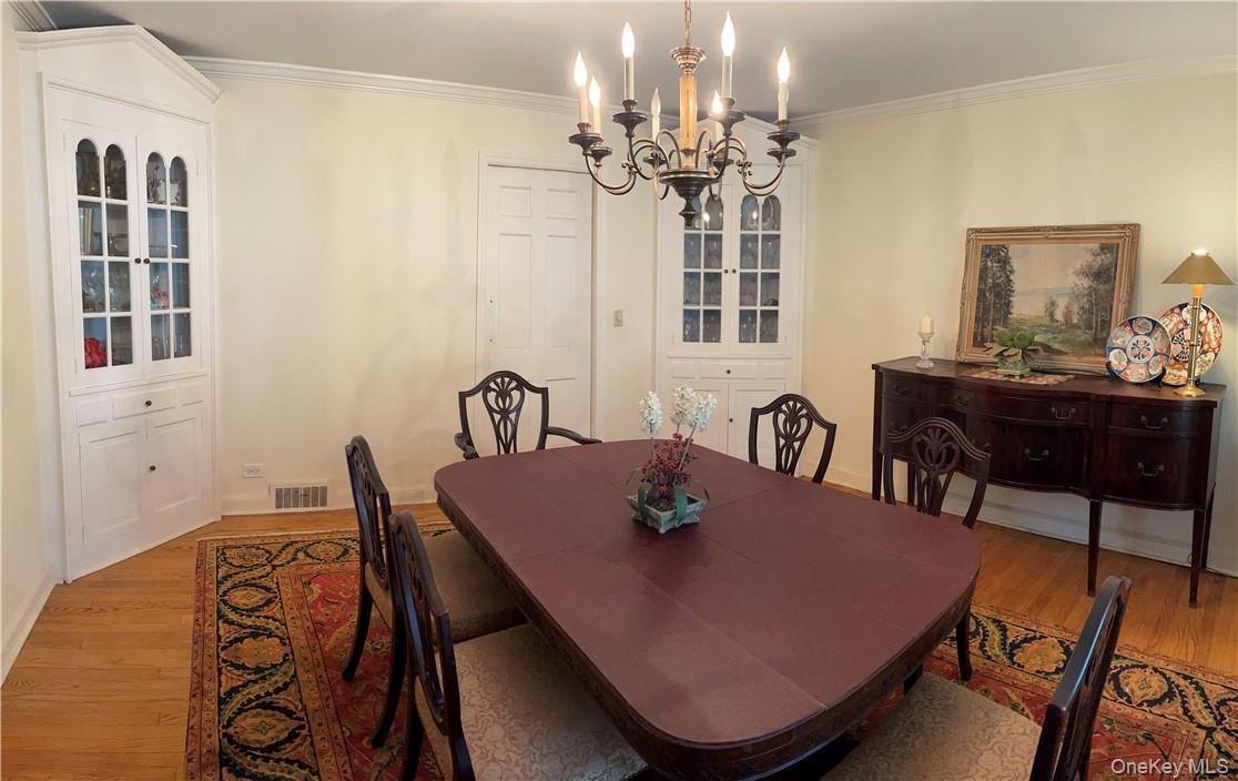 Formal dinning room with built in cabinets