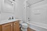 A hall bath serves the two second floor bedrooms and the sitting area.