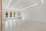 Spare room with light marble finish floors, a tray ceiling, recessed lighting, and radiator