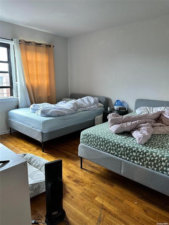 Bedroom featuring hardwood / wood-style floors