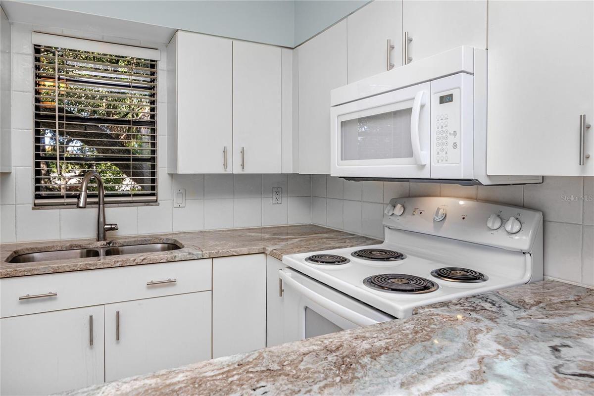 Upstairs unit was freshly painted and has beautiful granite countertops in the kitchen and bathroom.