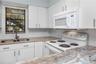 Upstairs unit was freshly painted and has beautiful granite countertops in the kitchen and bathroom.