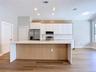 fully renovated kitchen with quartz countertops