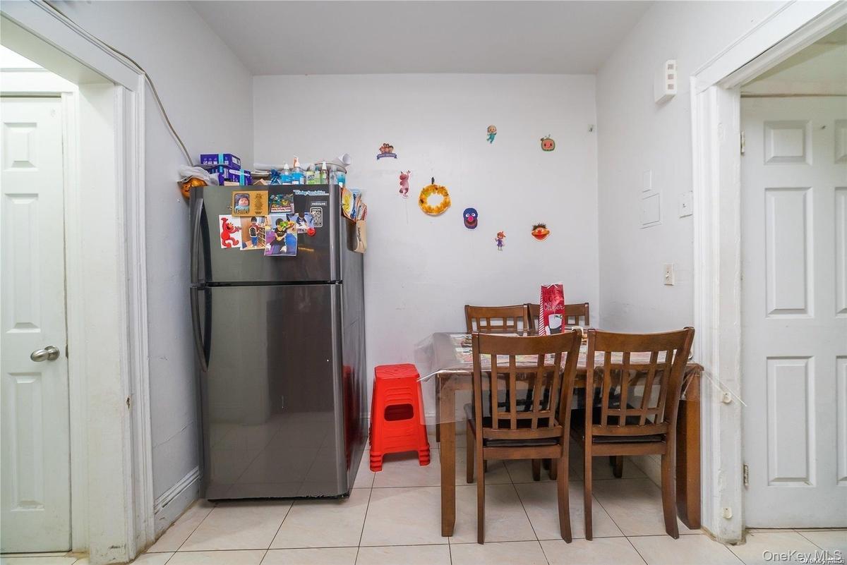 Dining room with light tile patterned floors