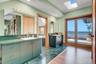 w/ double sinks, private outdoor balcony, huge walk in closet, and jacuzzi tub