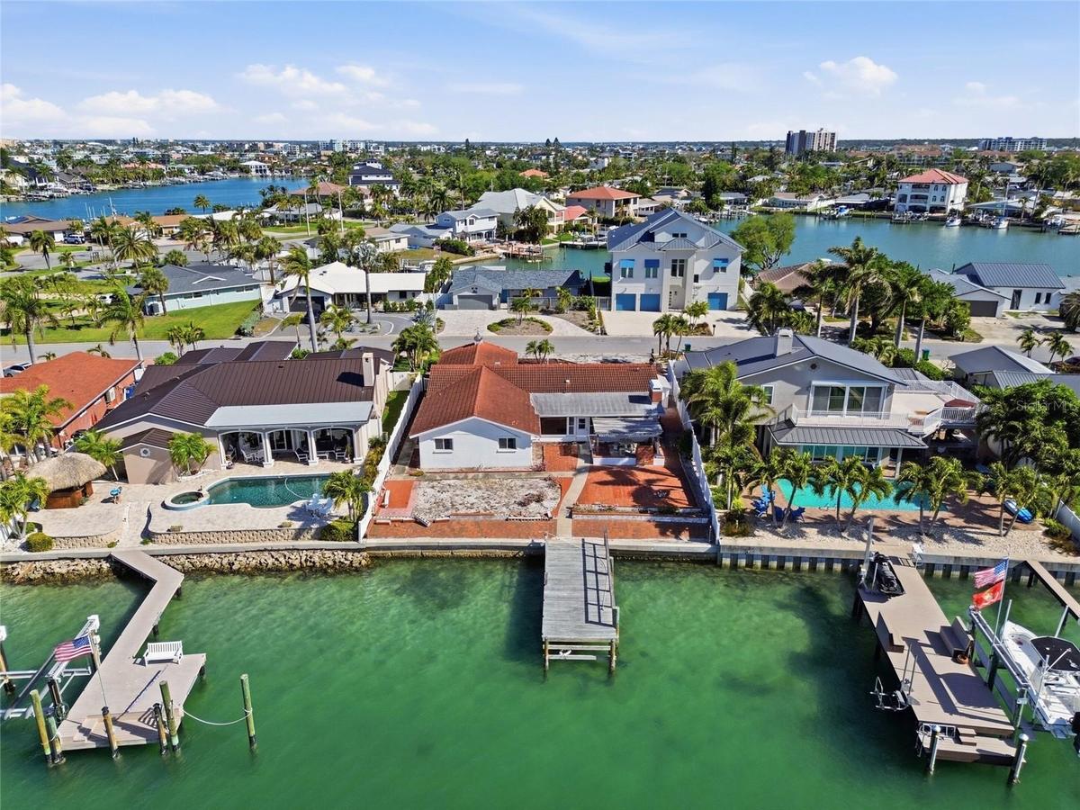 Drone shot of 4 Bellevue Drive looking south at The Devil's Elbow on the Intracoastal and the one bridge to the Gulf of Mexico in the foreground on th