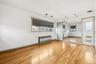 Unfurnished room with light wood-style flooring and radiator heating unit