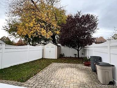 Fenced backyard featuring a patio area
