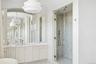Bathroom featuring a stall shower and vanity
