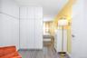Bedroom with light wood finished floors and baseboards
