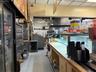 Kitchen with a drop ceiling, tile patterned floors, and tasteful backsplash