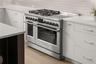Imagine cooking on this Fisher & Paykel range featuring 4 gas burners and 4 induction burners with an oversized stainless-steel hood!