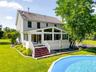 Rear view of home with pool.