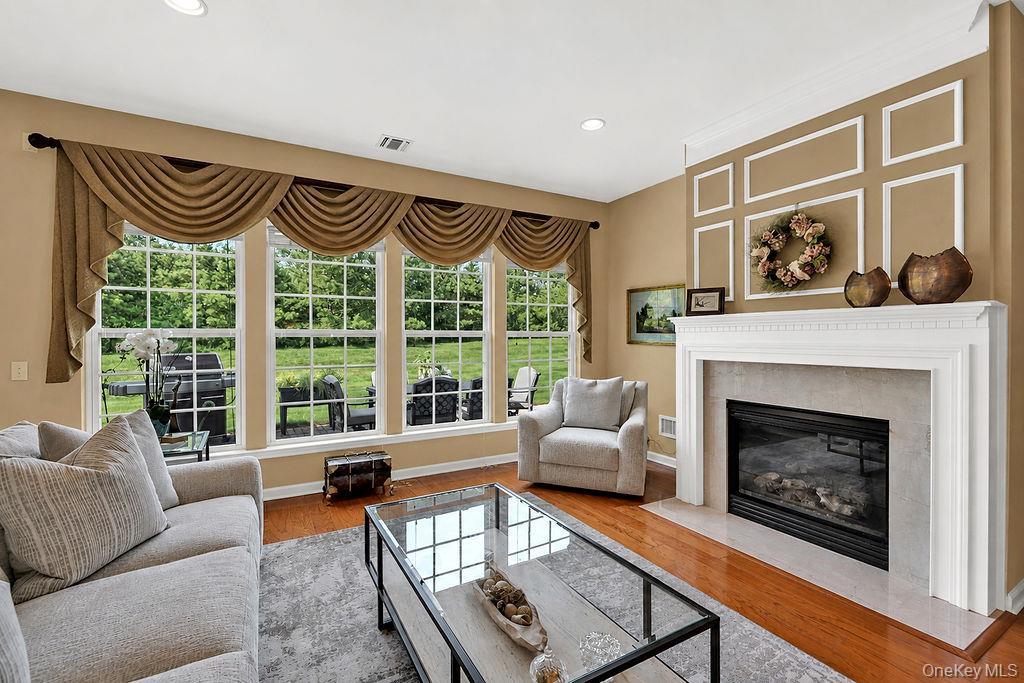 Living room with fireplace and abundant light