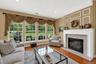 Living room with fireplace and abundant light