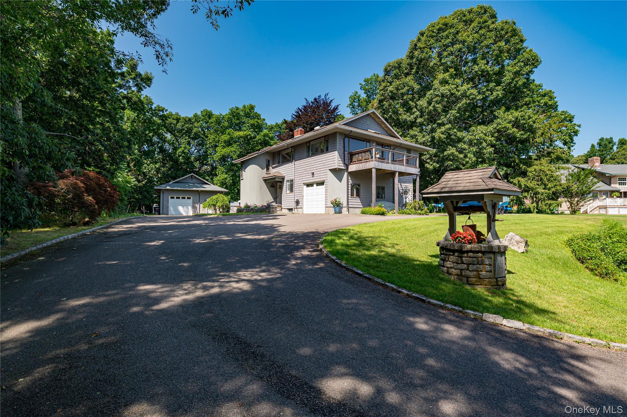 1.57 acres, attached & detached garage. Secluded