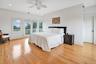 Second Floor Primary Bedroom featuring access to exterior, crown molding, light wood finished floors, ceiling fan, and recessed lighting