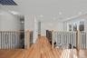 Corridor featuring light wood finished floors, an upstairs landing, and recessed lighting