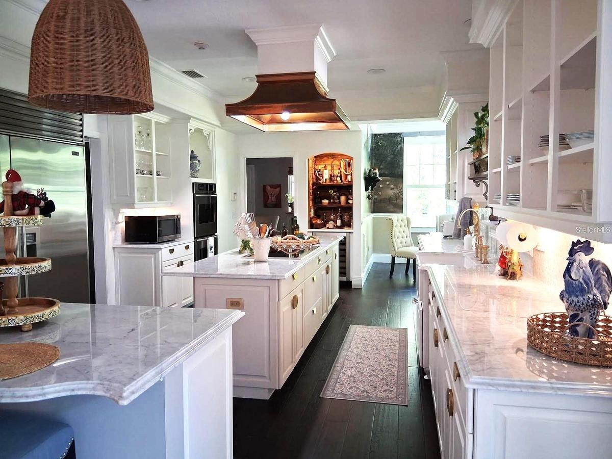 Complete Remodel. Quaint Farmhouse Bar. Marble Countertops. SubZero Fridge and much more