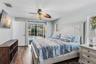 Main bedroom with sliding glass doors to the pool area