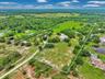 Long private driveway to the property, come through the gate and the shop is on the left side