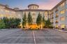 Distinguished entrance surrounded by beautifully landscaped grounds.(virtually staged dusk)